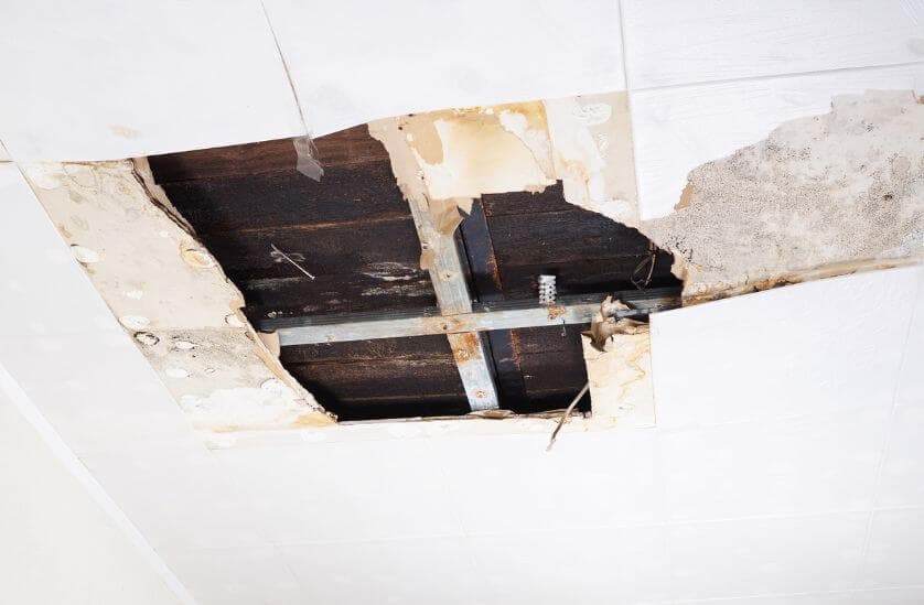 Ceiling collapsed from severe flood water damage with mold growth